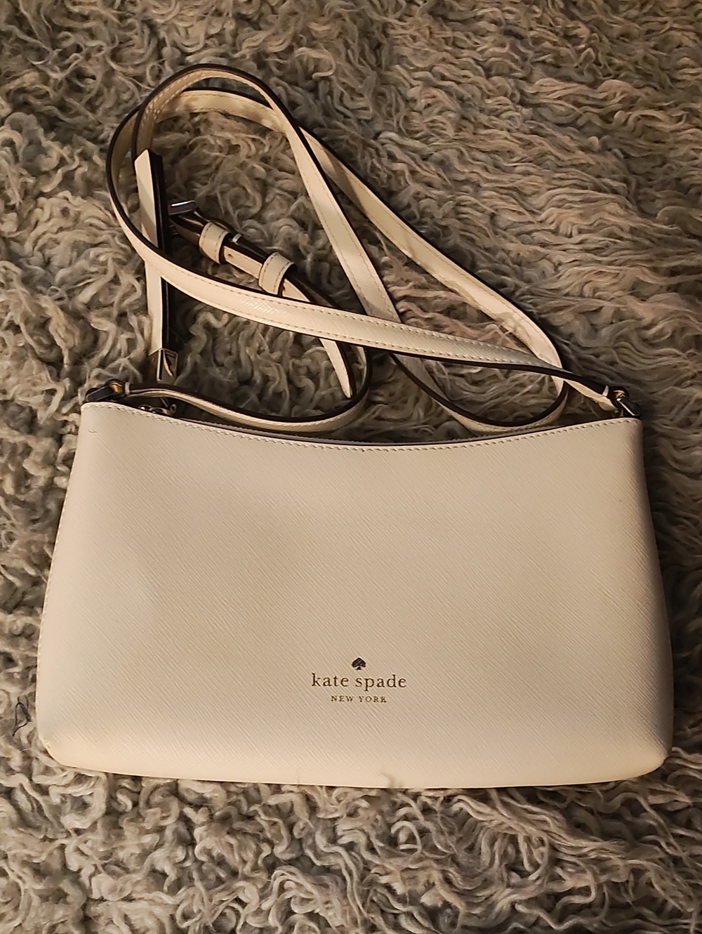 kate spade cream crossbody with gold logo accents